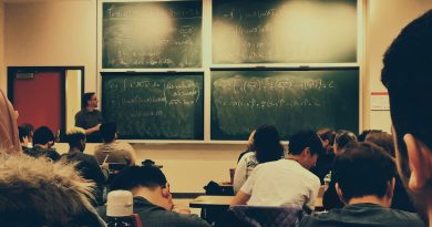 Classroom with AI technology and diverse students receiving feedback