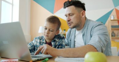 A teacher supporting a student with reading using personalized technology tools in a classroom setting