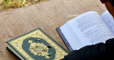 Student and teacher engaged in reading lesson with educational materials