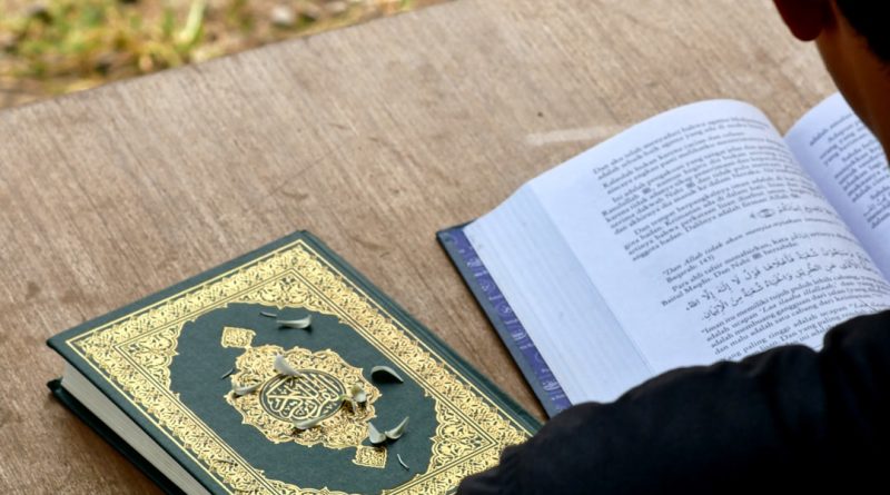 Student and teacher engaged in reading lesson with educational materials