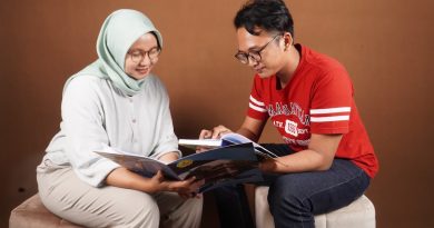 An educator guides a student through a reading lesson using technology-enhanced instruction