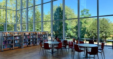 Contemporary architecture classroom with students collaborating on sustainable design projects
