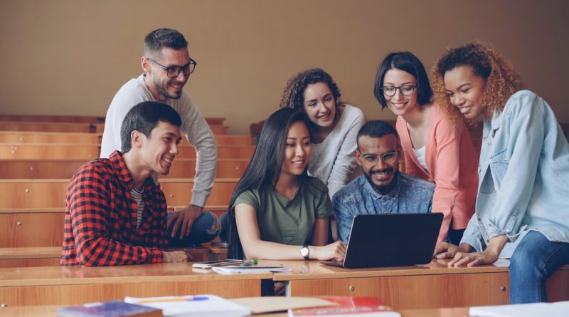 Students from diverse backgrounds engaged in collaborative learning environment