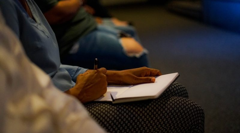 Student reviewing scholarship and financial aid documents while studying