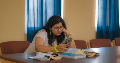 Student reviewing education financing documents and loan options at desk