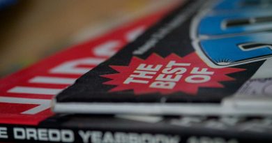 High school students browsing through yearbook pages together