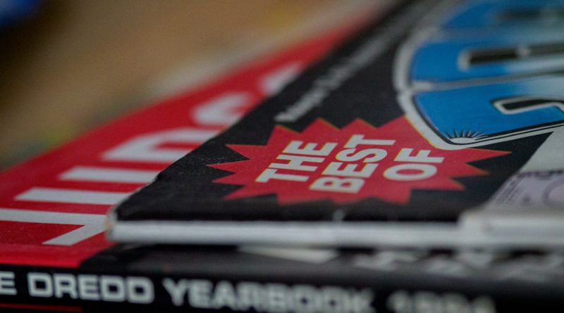 High school students browsing through yearbook pages together