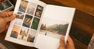 Students holding high school yearbooks and looking at memories together