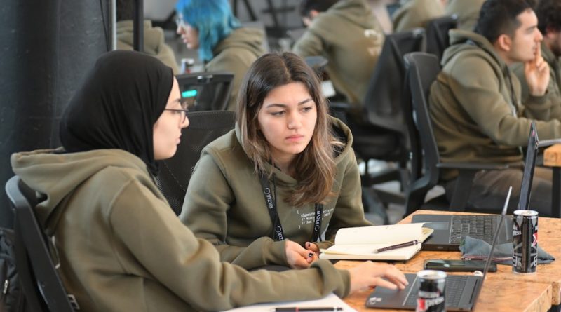 Diverse students engaged in humanities research and academic discussion