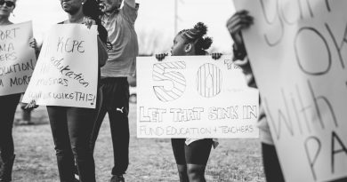 Teachers gathering for union meeting and voting on education policy matters