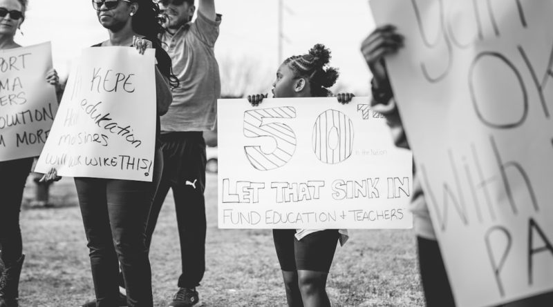 Teachers gathering for union meeting and voting on education policy matters