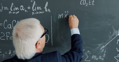 Students and teacher engaged in collaborative mathematics lesson in modern classroom