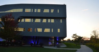 MIT campus with modern buildings and students studying