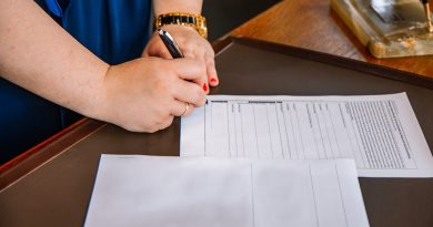 Student reviewing education loan documents and repayment options at desk