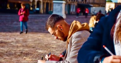 International student taking notes while studying in a foreign country