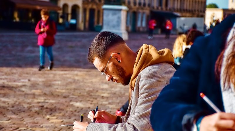 International student taking notes while studying in a foreign country