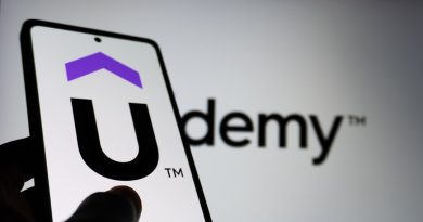 Students collaborating on practical technology project in modern classroom setting