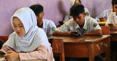 Students learning in a modern classroom with educational resources