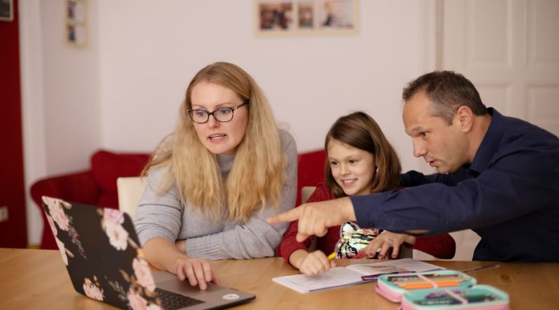 A tutor working with a student on reading and literacy skills during classroom tutoring session