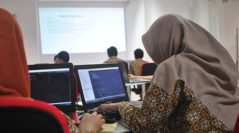 University professor teaching artificial intelligence and machine learning to students in modern computer science classroom