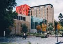 Students studying at an Australian university campus with modern buildings