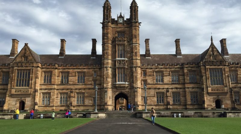 Indian students studying at Australian university campus with modern buildings