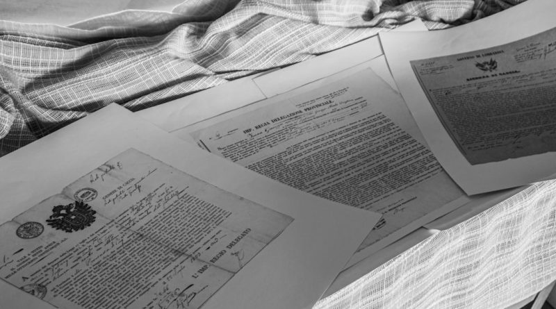 Student reviewing confusing college financial aid letter at desk