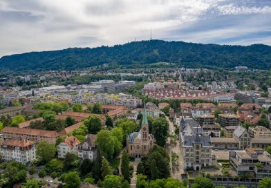 ETH Zurich main campus building with Swiss mountains in background
