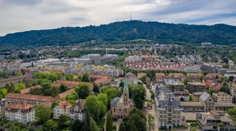 ETH Zurich main campus building with Swiss mountains in background