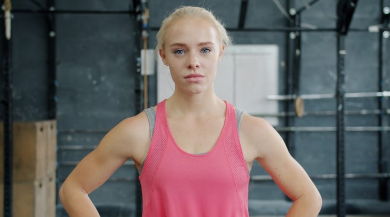 Female athlete competing in multi-event track and field competition