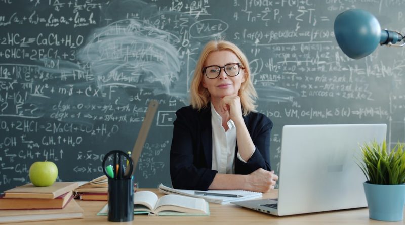 Modern classroom with teacher using AI assistant technology on interactive display