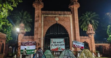 Students and faculty members gathered on a university campus during a demonstration