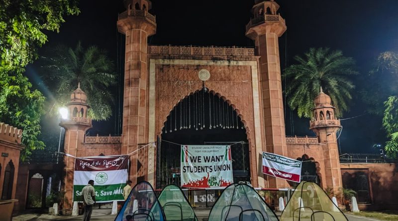Students and faculty members gathered on a university campus during a demonstration