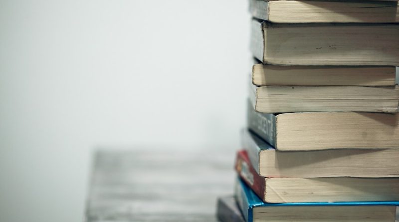 Indian student comparing IELTS and TOEFL exam preparation materials