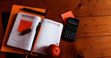 School administrator reviewing budget documents related to teacher compensation