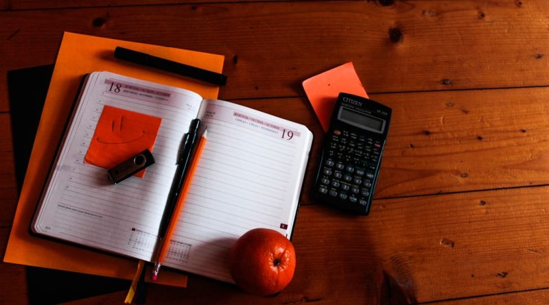 School administrator reviewing budget documents related to teacher compensation