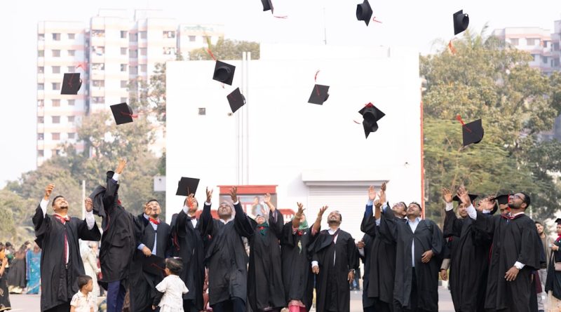 Confident graduate in academic regalia celebrating educational achievement