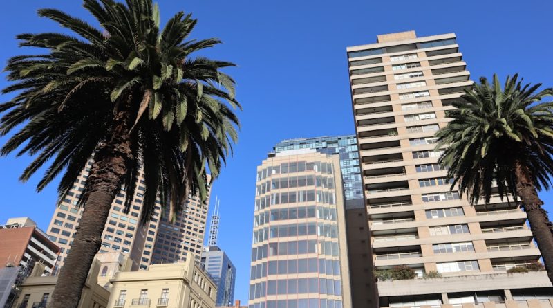 Modern student apartment building in Melbourne with city skyline view