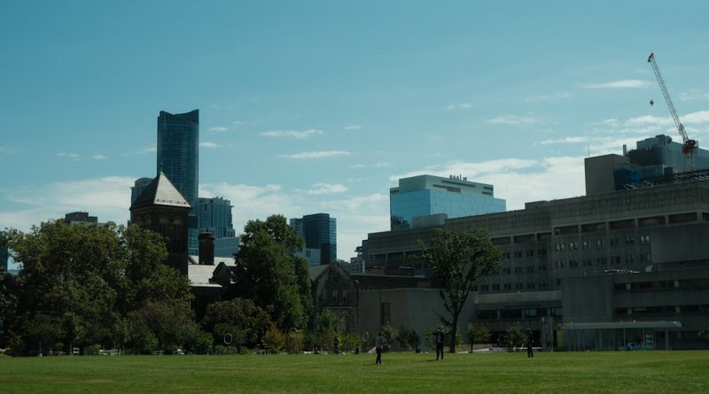 Indian students studying at a Canadian university campus with maple leaves and modern buildings