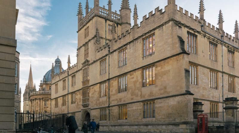 Indian students studying at UK university library and campus