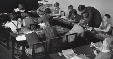 High school history classroom with students discussing American documents